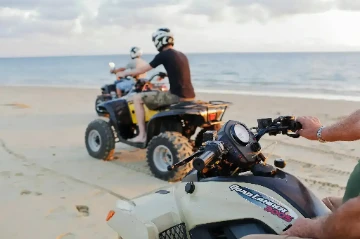 Adventure city tour on quad bike through Nosy Be Madagascar with local streets and landmarks